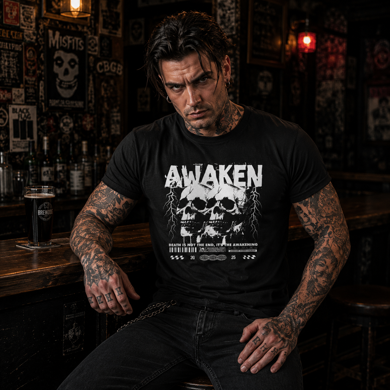 Awaken skull t-shirt, death is not the end shirt, gothic skull graphic tee, black metal style t-shirt, punk rock graphic tee, alternative men’s fashion, black graphic tee men, tattooed punk outfit, dark streetwear men, bar stool photo shoot, punk pub outfit, edgy skull shirt, grunge men’s clothing, rock bar fashion, monochrome skull tee, death quote t-shirt, rebellious streetwear, old school punk style, hardcore punk shirt, gothic men’s shirt, skull lover gift, alternative nightlife outfit, dark graphic app