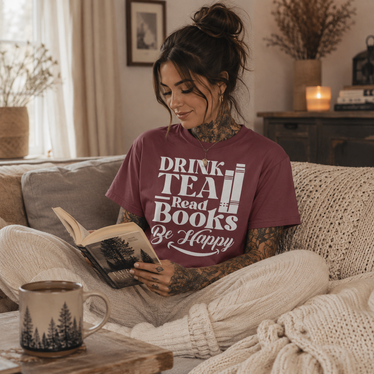 drink tea read books be happy shirt, book lover t-shirt, tea lover graphic tee, cozy reading shirt, bibliophile gift, bookworm t-shirt, reading lifestyle apparel, book and tea shirt, cozy scandi outfit, boho book lover shirt, women’s reader t-shirt, literary graphic tee, comfort colors book shirt, dusty rose graphic tee, romance reader shirt, cozy sofa reading outfit, book club gift, reader gift for women, Scandinavian boho style, Merloan book lovers shirt