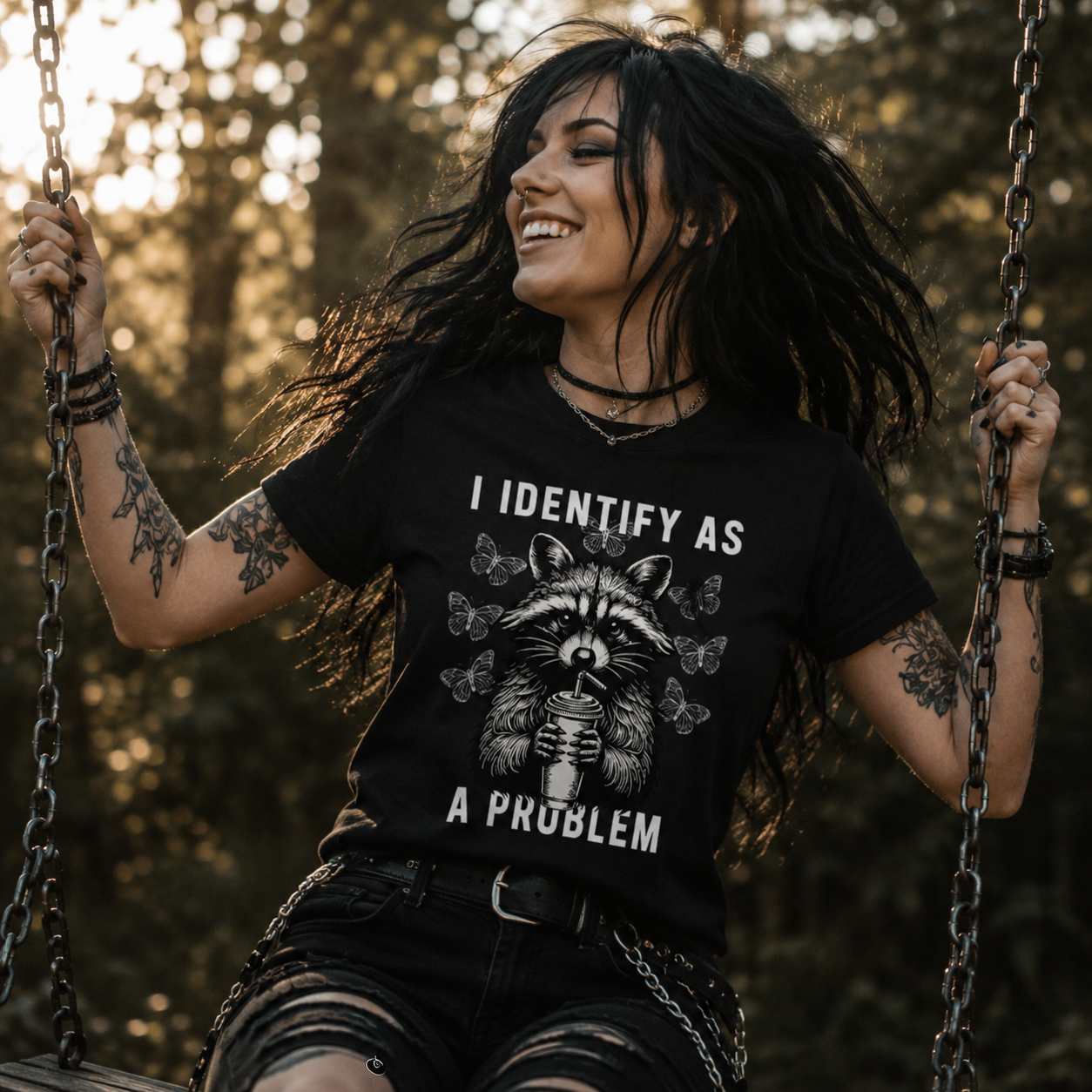 funny raccoon t-shirt, I identify as a problem shirt, sarcastic raccoon tee, alternative graphic t-shirt, rock girl shirt, mischievous raccoon design, edgy humor clothing, black raccoon t-shirt, quirky animal graphic tee, grunge fashion shirt, punk style t-shirt, funny wildlife shirt, rebellious women’s tee, alternative streetwear, cute but chaotic shirt, raccoon lover gift, humorous statement t-shirt, gothic casual outfit, rock festival fashion, unisex funny graphic tee