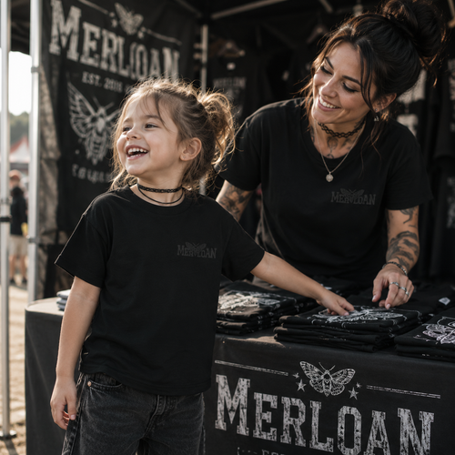 kids black t-shirt, Merloan kids shirt, embroidered logo t-shirt, tonal black logo tee, rock festival kids outfit, alternative kids clothing, rock style girl t-shirt, black children’s shirt, matching mother daughter shirts, festival family outfit, gothic kids fashion, alternative family clothing, subtle logo t-shirt, black on black embroidery, rock merch kids shirt, concert outfit for girls, edgy children’s fashion, unisex kids t-shirt, minimalist black kids tee, mother daughter matching outfit, festival me