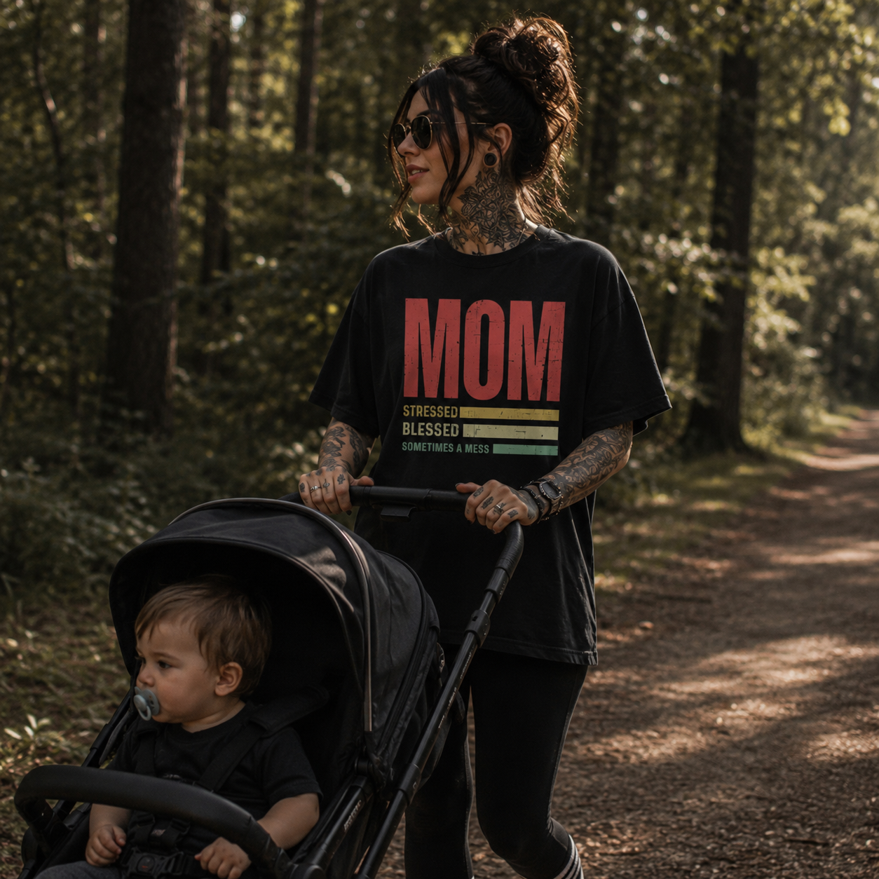 mom stressed blessed mess shirt, funny mom life t-shirt, alternative mom graphic tee, rock mom shirt, motherhood chaos tee, stroller walk outfit, toddler mom apparel, busy mom t-shirt, vintage mom graphic shirt, stressed blessed mom gift, mom of boys shirt, everyday mom style, forest walk mom outfit, black graphic t-shirt, edgy motherhood fashion, cool mom clothing, parenting humor shirt, casual mom streetwear, retro mom life tee, Merloan mom shirt
