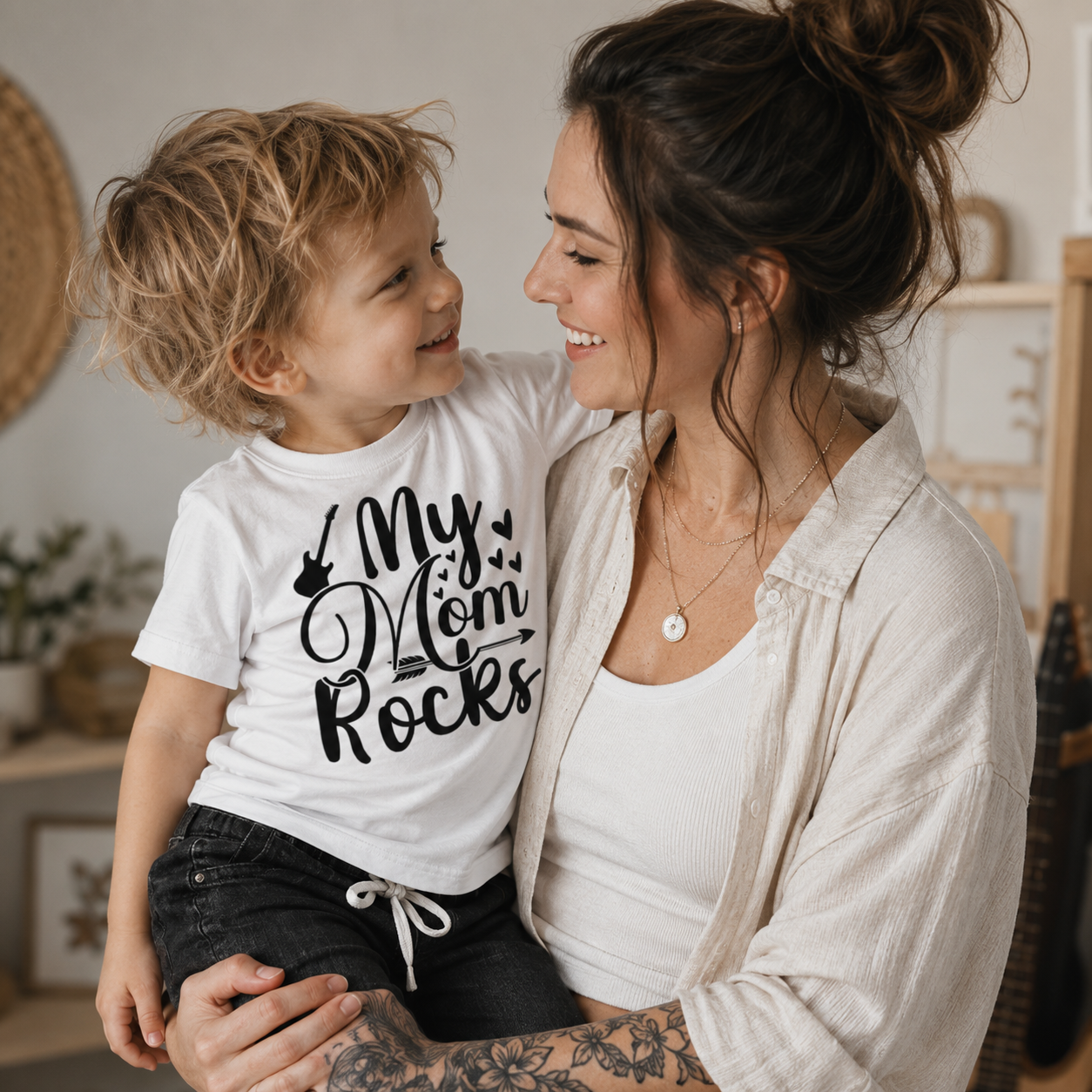 my mom rocks t-shirt, kids mom shirt, mother appreciation shirt, mommy and me clothing, rock mom kids shirt, little rocker t-shirt, music inspired kids clothing, guitar kids shirt, white graphic t-shirt, black typography shirt, boys mom shirt, girls mom shirt, unisex kids t-shirt, toddler mom shirt, preschool kids tee, children’s graphic shirt, short sleeve kids t-shirt, front print shirt, alternative kids clothing, rock and roll kids fashion, cool kids clothing, playful kids outfit, statement kids t-shirt,
