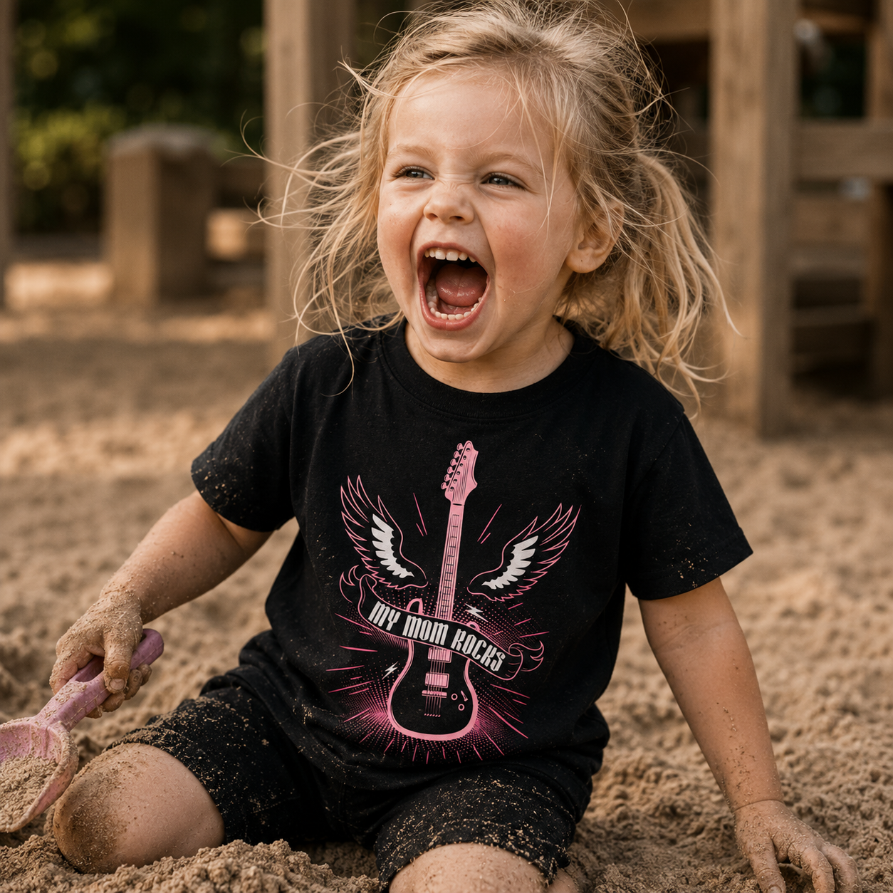 my mom rocks t-shirt, kids rock shirt, girls rock t-shirt, little rocker shirt, rock and roll kids clothing, guitar kids shirt, electric guitar t-shirt, music lover kids tee, rock mom shirt, mom appreciation shirt, cool mom kids shirt, alternative kids clothing, punk kids fashion, metal kids clothing, black graphic t-shirt, pink guitar design, winged guitar shirt, girls music shirt, boys music shirt, unisex kids t-shirt, wild child outfit, toddler rock shirt, preschool kids t-shirt, little rebel clothing, c