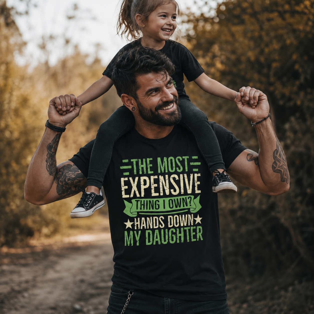 the most expensive thing I own shirt, funny dad t-shirt, daughter dad shirt, girl dad graphic tee, proud father shirt, dad and daughter outfit, funny parenting shirt, alternative dad style, muscular dad t-shirt, father daughter gift, dad life graphic tee, black funny dad shirt, parent humor apparel, girl dad gift, family lifestyle shirt, cool dad fashion, fatherhood quote tee, dad with daughter shirt, Merloan dad shirt, Merloan family shirt